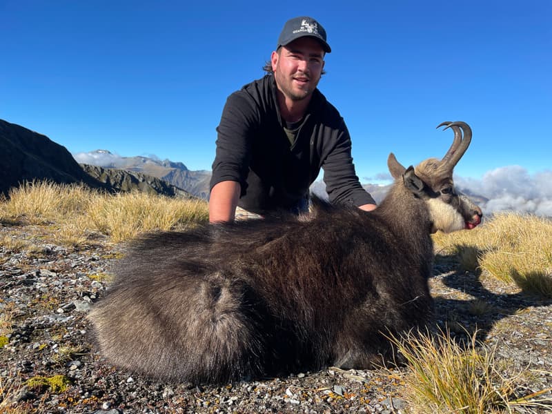 A young hunter in the high country above the cloud line